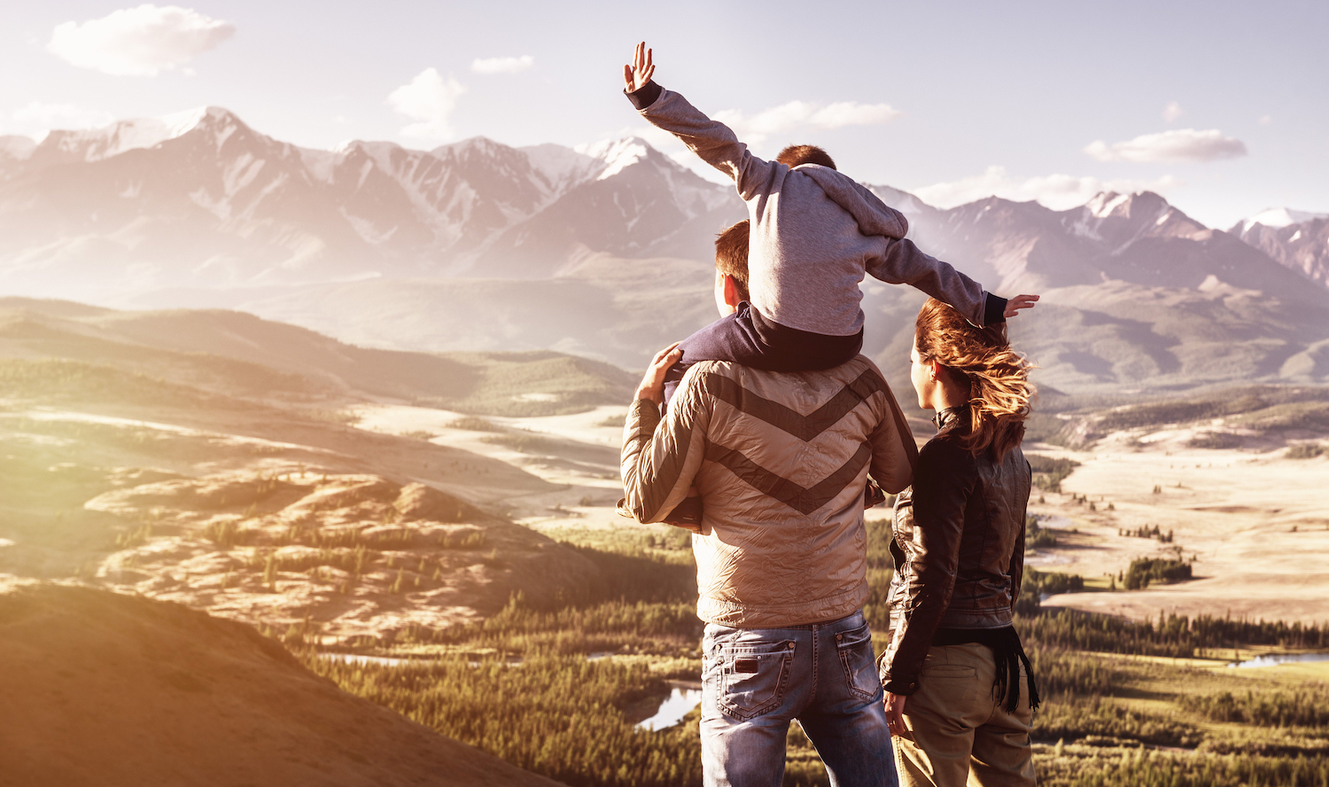 family looking over mountains hero